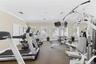 Fitness center featuring multiple treadmills, strength training equipment, mirrored wall, recessed lighting, and crown molding