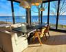 Sunroom featuring a water view