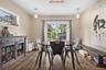 Eat-In Kitchen – Bright and inviting dining area seamlessly connected to the gourmet kitchen, featuring hardwood flooring, stylish pendant lighting, a
