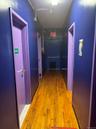 Corridor featuring light wood-style floors and elevator