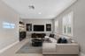 Virtually staged up stairs bonus room