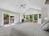 Step right out onto the spacious wrap around deck to enjoy the outdoors in this tropical oasis.