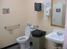 Half bathroom with toilet and a sink