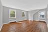 Unit #2-Bright living room with large windows and an open feel.
