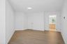 Another perspective of primary bedroom open to updated ensuite bath