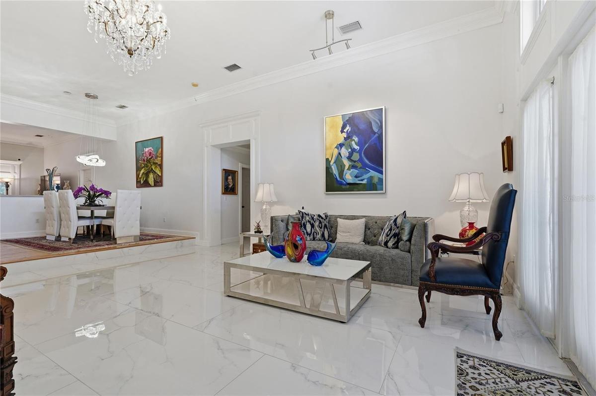 LIVING ROOM HAS 12' CEILINGS, 10" CROWN MOLDING WITH BEAUTIFUL WOODWORK