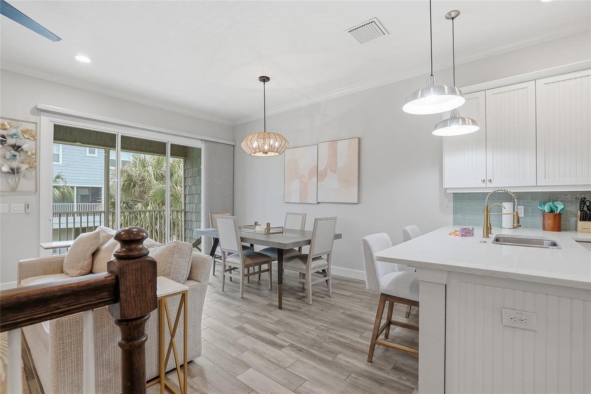 As you arrive on the second level, you’re greeted by a beautiful kitchen and a light, bright space.