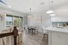 As you arrive on the second level, you’re greeted by a beautiful kitchen and a light, bright space.