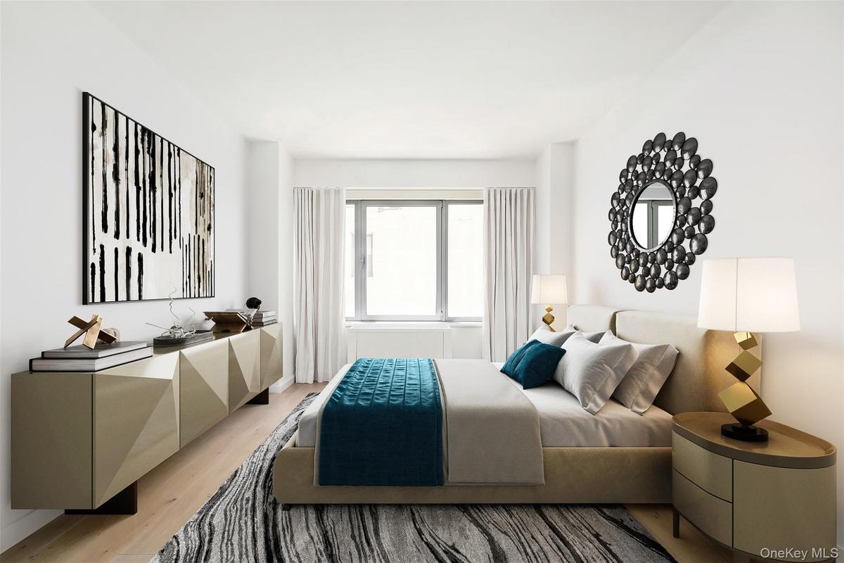 Hardwood-style flooring extends throughout this room, complemented by a large window with white draperies, a built-in radiator, and white walls