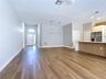 bright open-concept layout with new vinyl flooring, a fully renovated kitchen