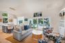 Living room with all new furnishings and decor and original artwork by local artists