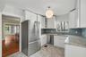 Thoughtfully designed storage and counter space make this bright kitchen as practical as it is welcoming.
