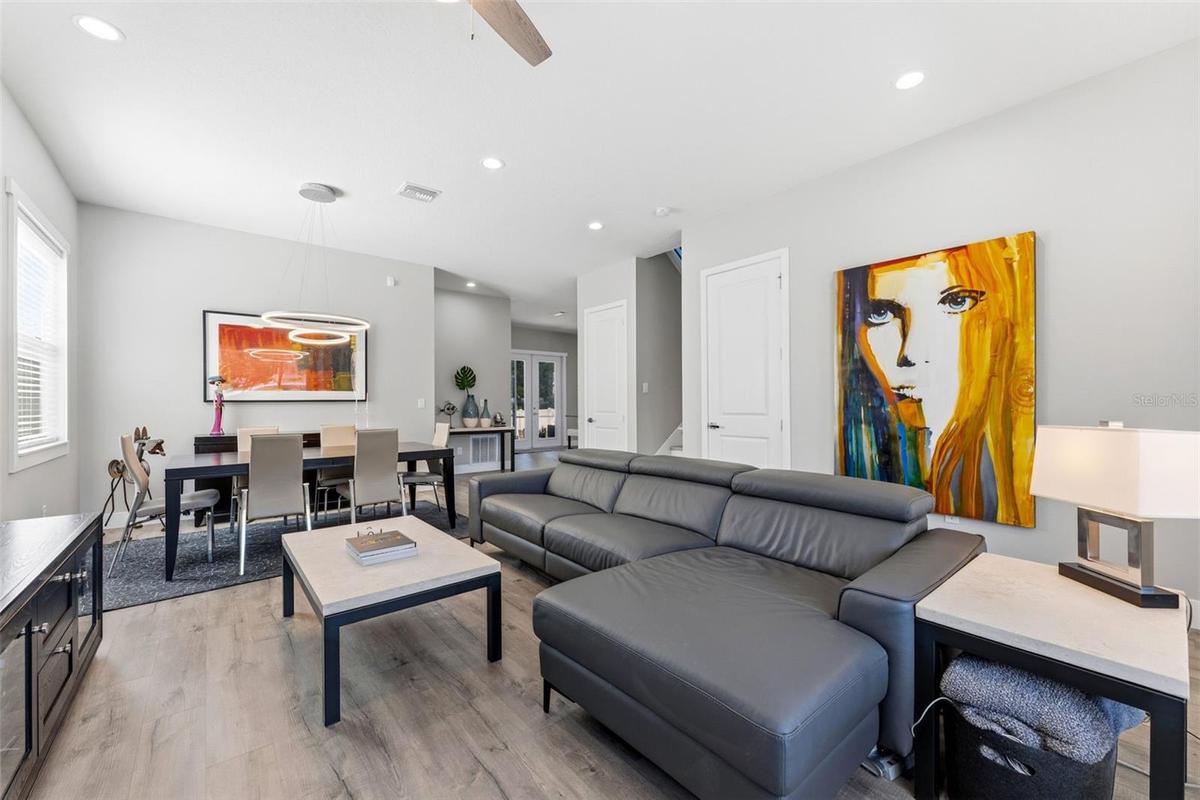 Living Room/Dining Room with high ceilings, custom light fixtures and open concept living