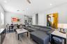 Living Room/Dining Room with high ceilings, custom light fixtures and open concept living