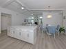 Perfectly redesigned kitchen overlooks the dinette and family room