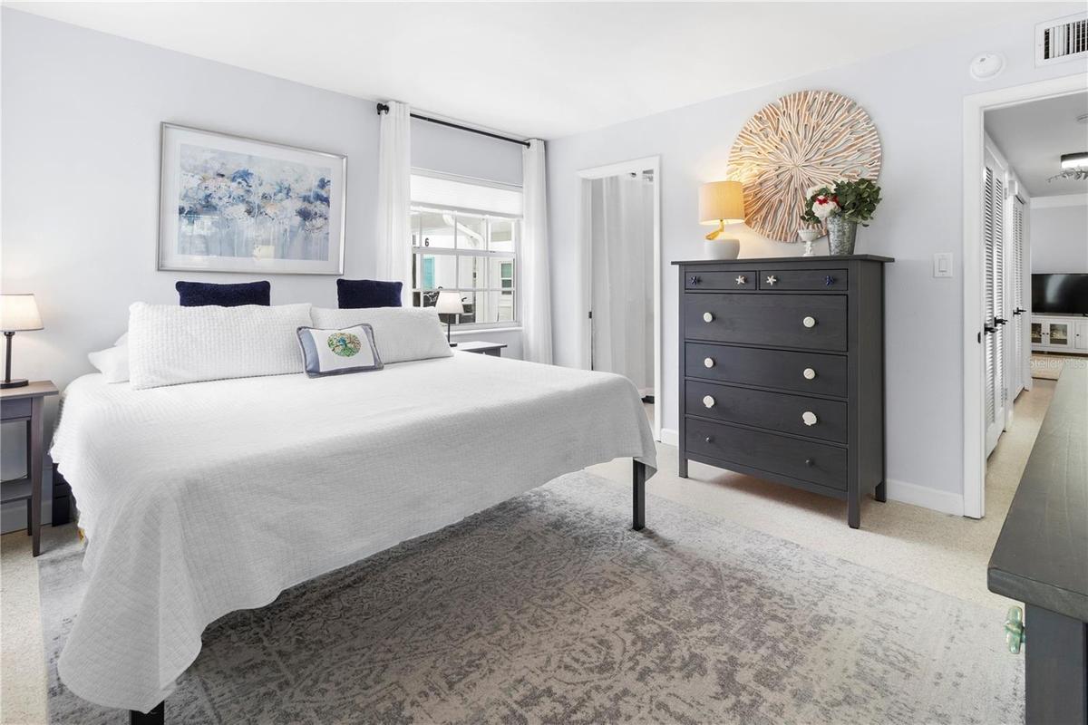 Primary Bedroom with King Bed and closet door open
