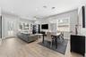 Living Room/Dining Room with high ceilings, custom light fixtures and open concept living