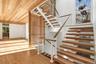 Stairway featuring wood finished floors and wood ceiling