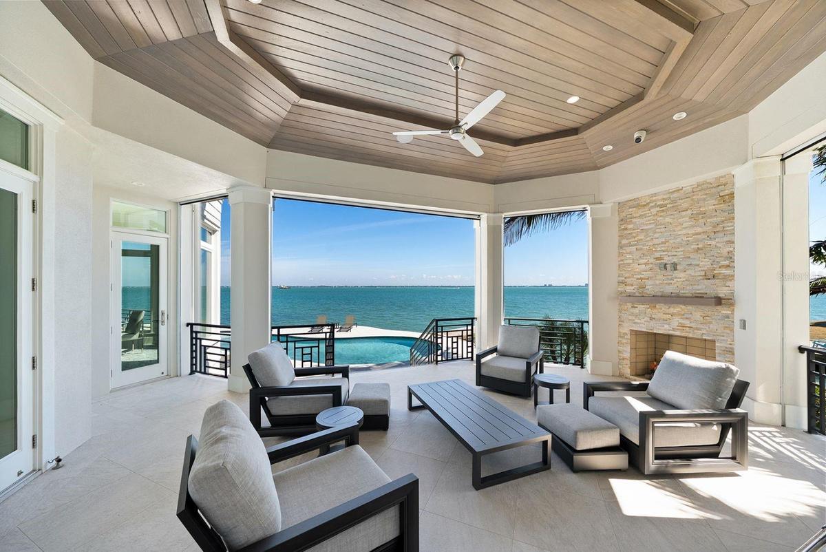 Outdoor surround lanai with disappearing screens