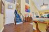 Foyer featuring high vaulted ceiling, hardwood / wood-style flooring, stairway, recessed lighting, and a chandelier