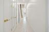 Corridor with recessed lighting and light marble finish flooring
