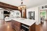 Quartz countertops and oversized island with additional storage and built in microwave