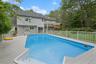 View of pool with a patio, a pergola, and a deck