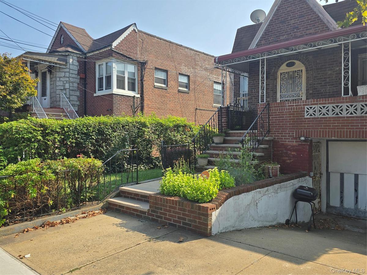 View of front of property featuring brick siding and a porch
