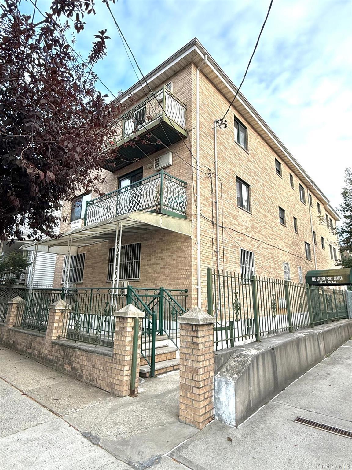 View of building exterior with a fenced front yard