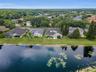 Aerial view of pond and home