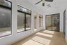 Florida room in back of home provides stunning conservation views with central AC