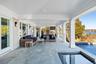 View of patio / terrace featuring an outdoor pool, an outdoor living space, and a water view