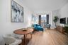 Sitting room featuring light wood finished floors, ornamental molding, and baseboards