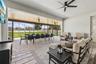 The covered lanai has been extended to create an outdoor oasis with multiple seating areas.