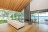 Sunroom featuring a water view, wood finished floors, high vaulted ceiling, healthy amount of natural light, and wood ceiling