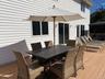 Wooden terrace featuring outdoor dining area and a gazebo