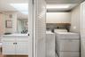 Full sized in unit washer and dryer, a peek at the seond bath