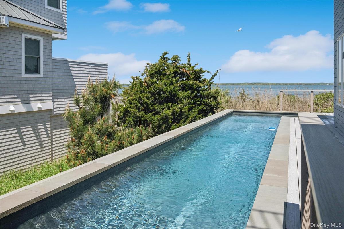 Outdoor pool featuring a water view