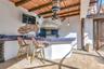 Summer kitchen with bar area ,gas grill, sink and refrigerator