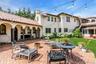 Private country club backyard featuring mature landscaping, fully fenced, brick patios, IGP & Spa, fountains
