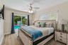 Bedroom 2 with sliding glass door to pool