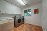 1st floor huge laundry room with plenty of storage & walk in closet