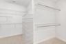 Spacious walk-in closet - virtually decluttered