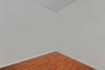 Unfurnished room with baseboards and wood finished floors