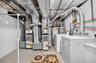 Basement Utility Room with 2 Separate A/C Handlers and water heaters