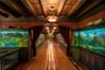 Rec room with beam ceiling, an inviting chandelier, wood ceiling, and wood-type flooring