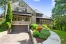 Mid-century inspired home featuring driveway and a garage