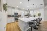 Not to be outdone, the interior delivers a bright, flowing layout anchored by a CHEF’S GOURMET KITCHEN that truly serves as the heart of the home.