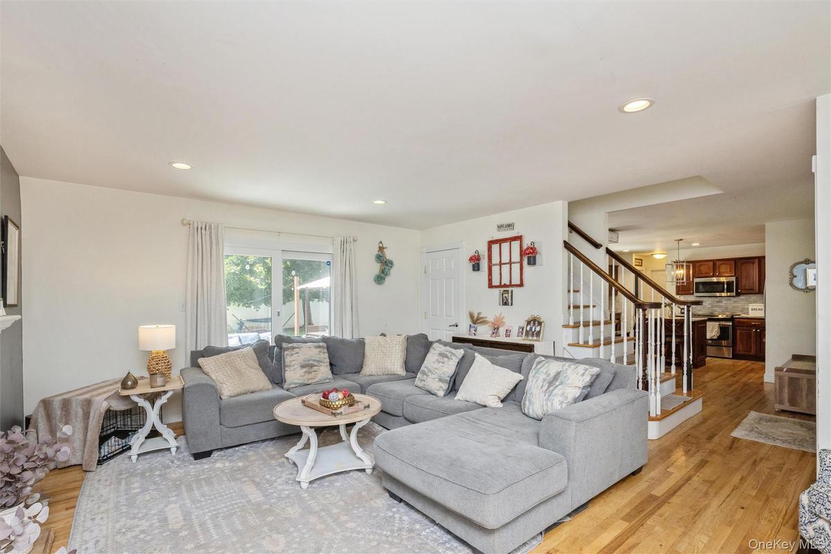 Living Room with sliders to Backyard