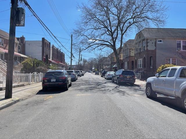 View of road featuring sidewalks and a residential view